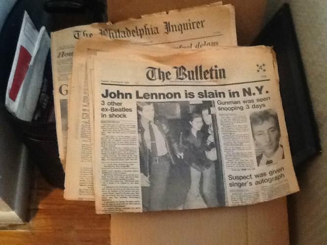 Newspaper headline: John Lennon is Slain