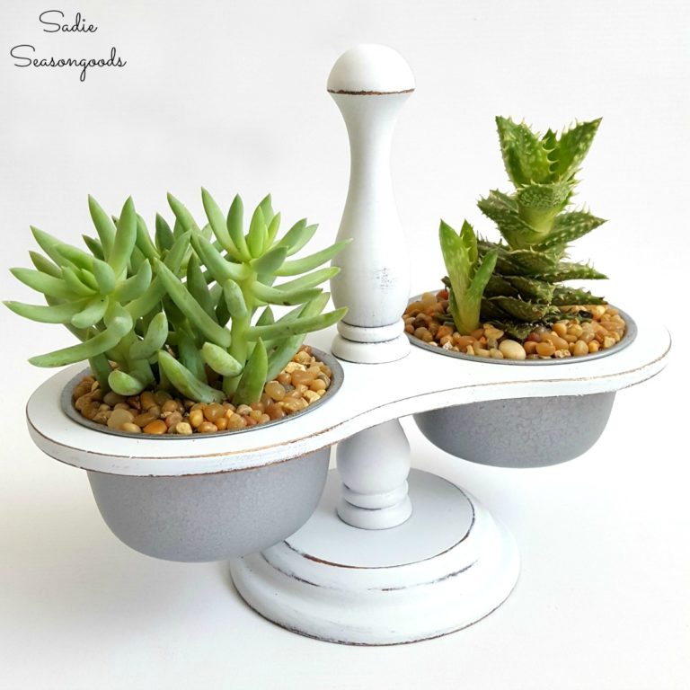A upcycled, two-sided planter holds succulents.