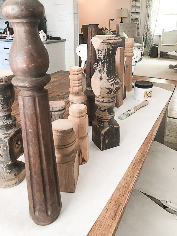  Several wooden table legs sit on top of a table. 