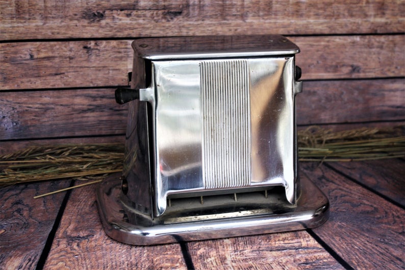 Chrome toaster on wood.