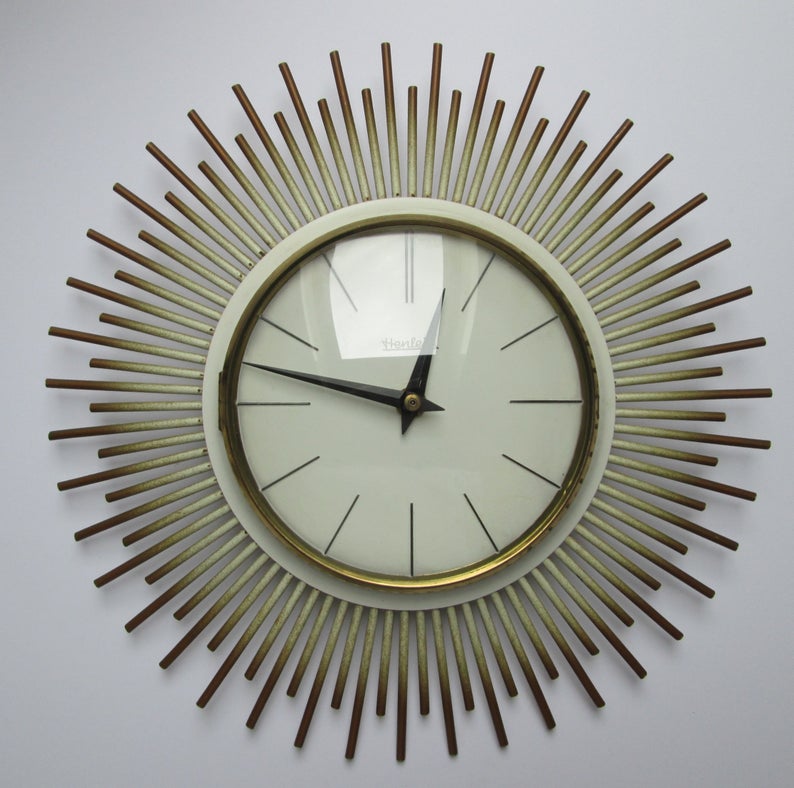 A 1960s Henlein sunburst wall clock.