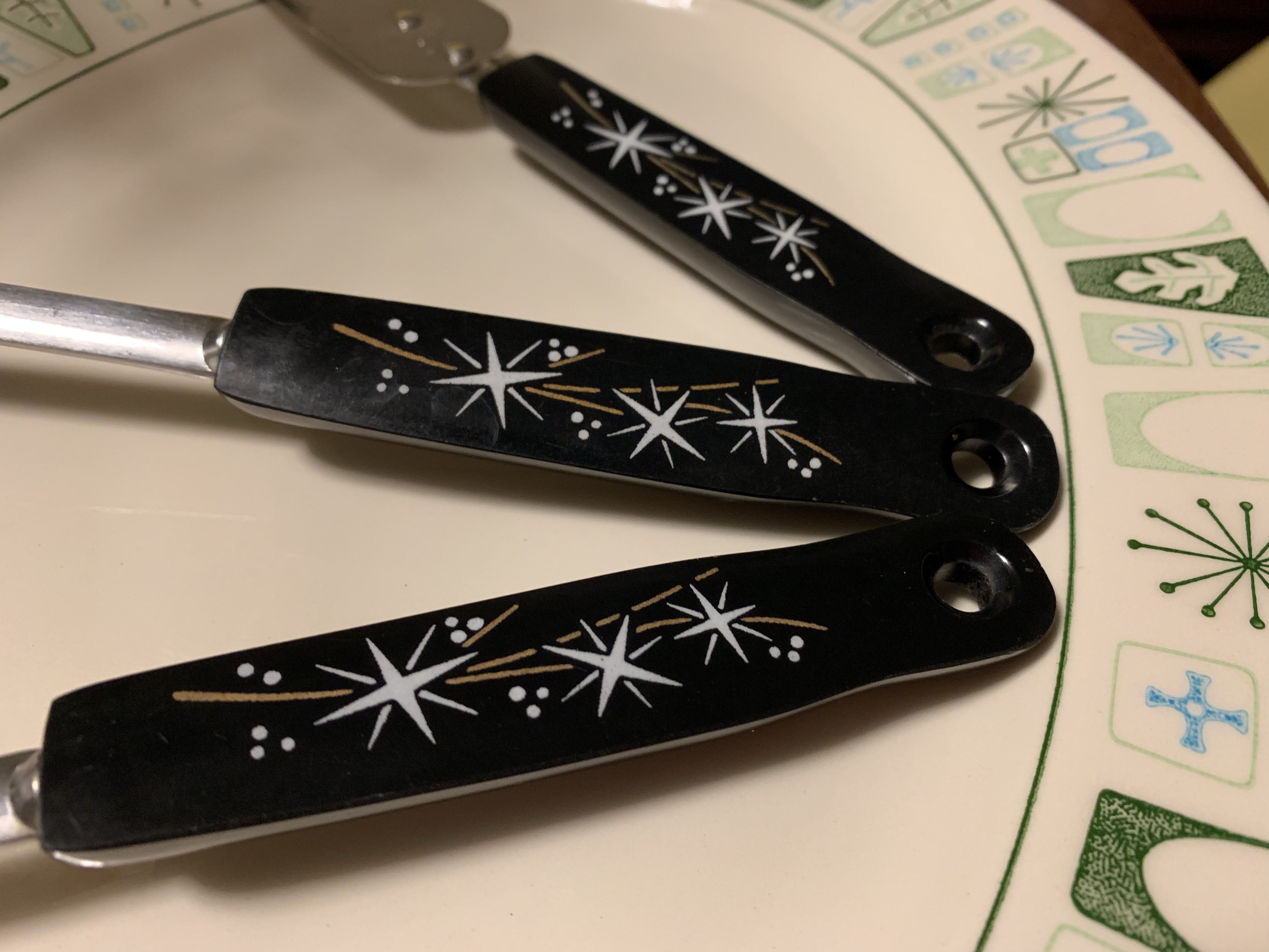 Black knives with white stars.