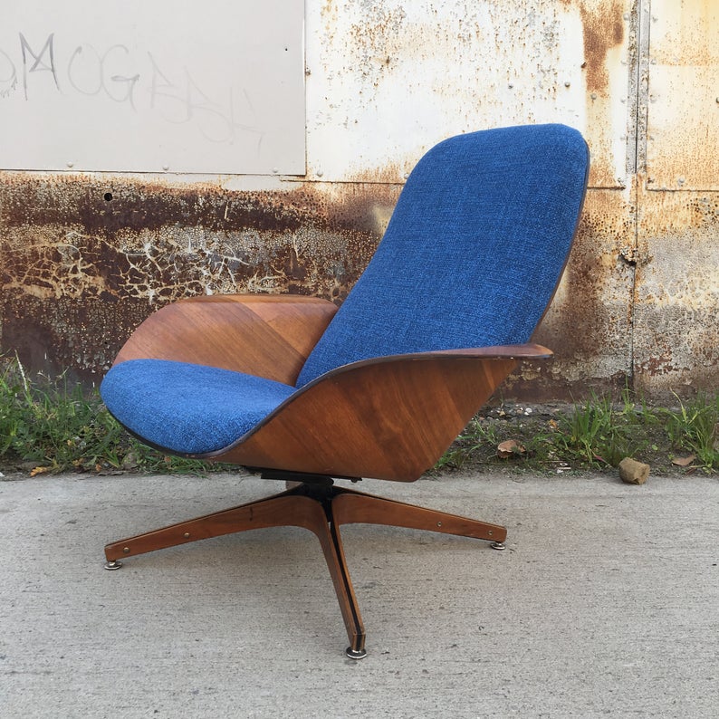 Wooden chair with blue upholstery.