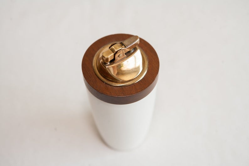 White, wooden and gold lighter.