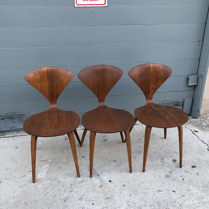 Three brown wooden chairs