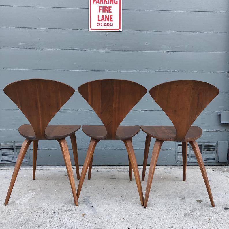 Three brown wooden chairs