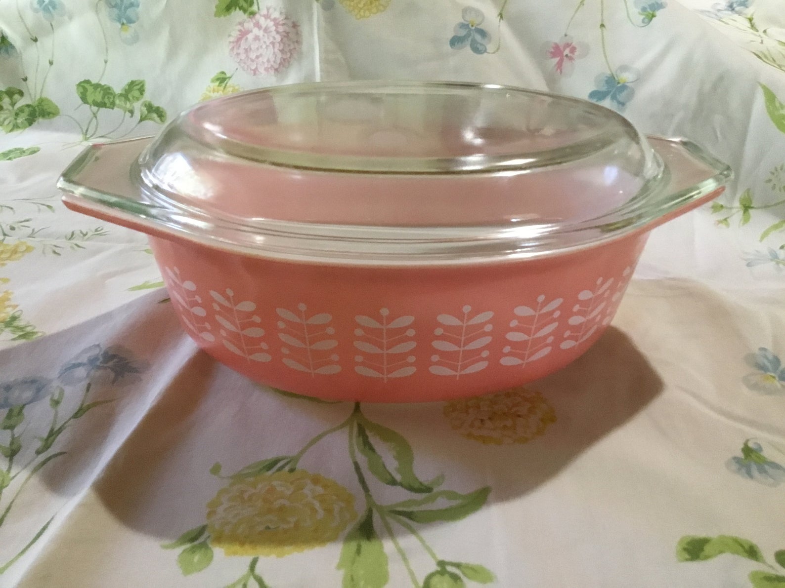 Clear with white design. Vintage pyrex casserole bowl with lid